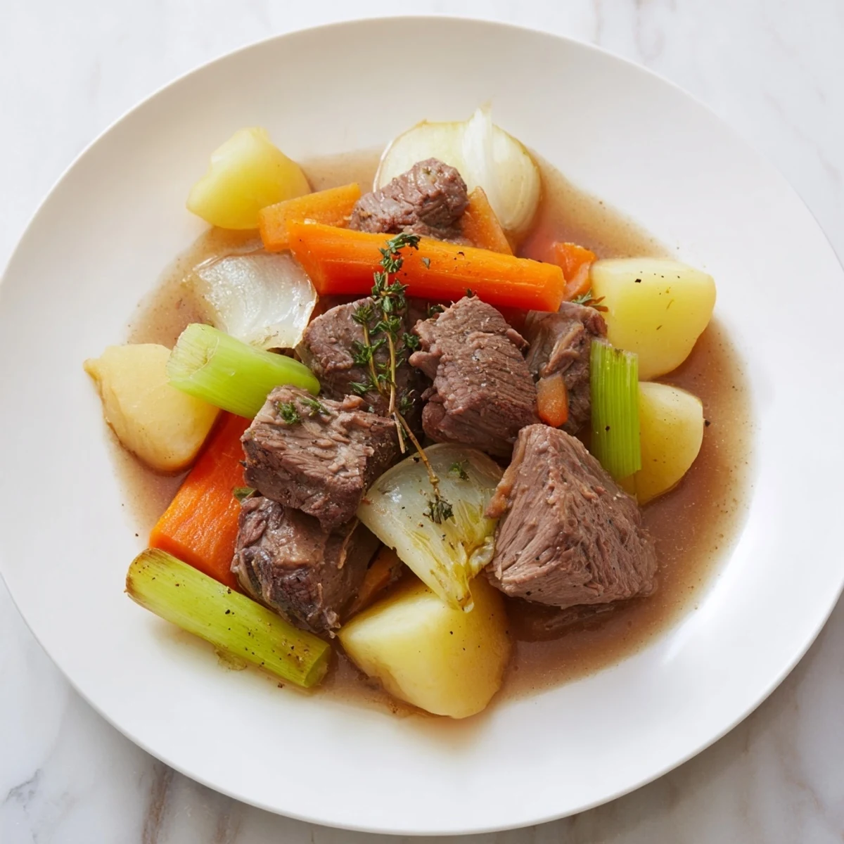 A heartwarming close-up of Pot-au-Feu, showcasing the rich broth and hearty beef chunks.