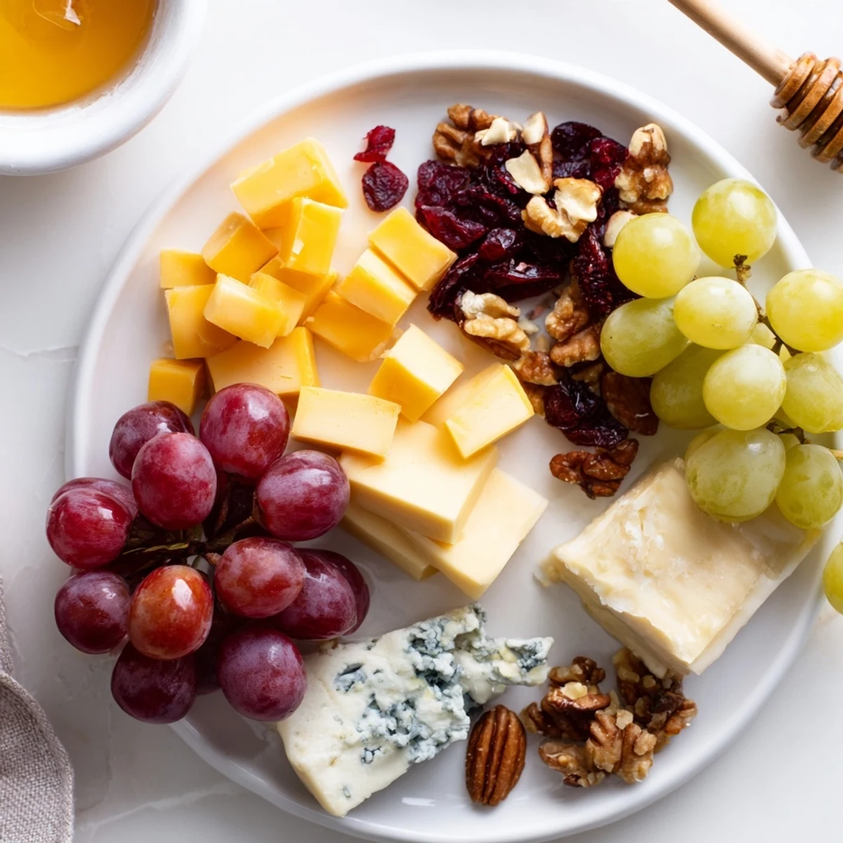 A beautiful cheese and fruit Cranberry Grape Man Cheese Board, ready to serve for a delightful snack.