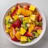 Refreshing Pineapple Mocktail Salad Bowl showing colorful fruits ready to be enjoyed, perfect for a summer dessert.