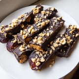 This mouthwatering Snickers-Style Date Bark showcases chopped peanuts atop a rich chocolate blanket.