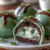 Festive St. Patrick's Day green Oreo truffle balls coated in smooth white chocolate and colorful sprinkles.  