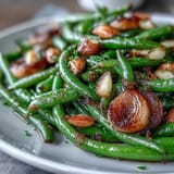 Tender green beans roasted until blistered, tossed with golden garlic and fresh lemon.  