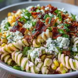 Elote-inspired pasta tossed with smoky paprika, chili powder, and fresh cilantro for a bold, tangy flavor.  