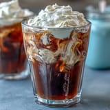 Creamy Cold Brew Coffee with Vanilla Sweet Cream, a refreshing iced treat.