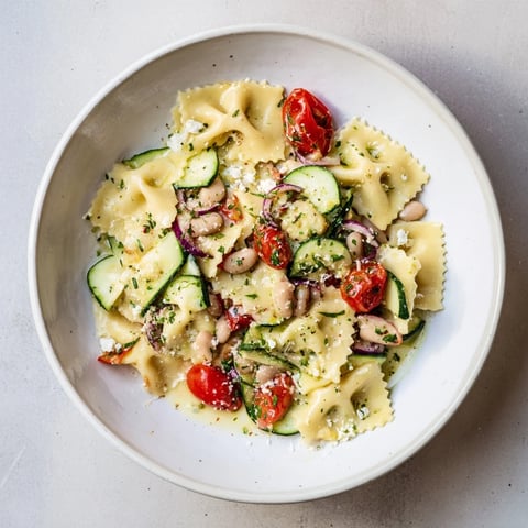 Mediterranean White Bean Salad with Feta, bursting with vibrant colors and fresh, chopped vegetables.