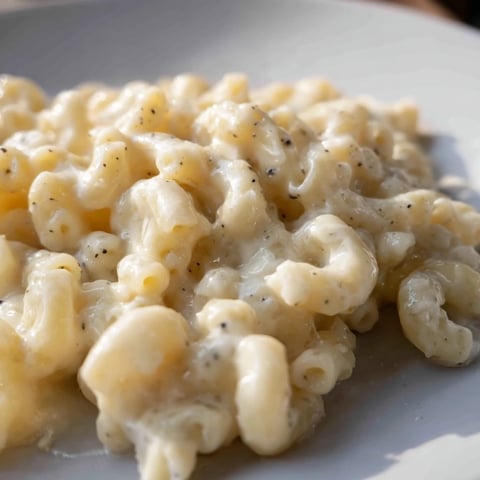 Golden, bubbly baked mac and cheese, with a crispy panko topping, ready to be served.