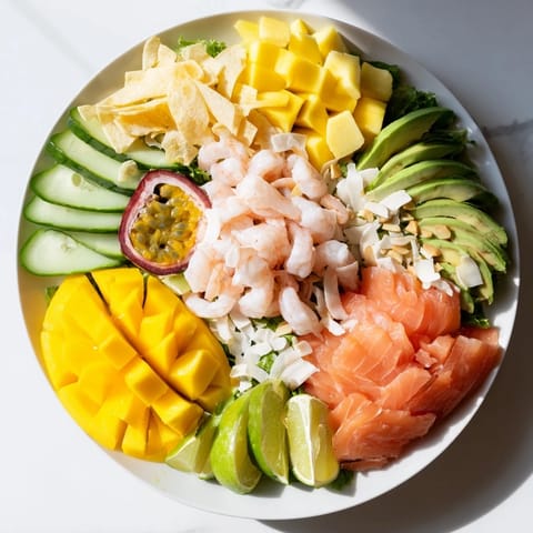 Delectable Tropical Wave Tasting Platter showcasing shrimp, mango, and coconut alongside flavorful dipping sauces.