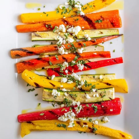 Freshly roasted Christmas Sleigh Veggie Rails boast vibrant colors and are drizzled with a savory marinade.