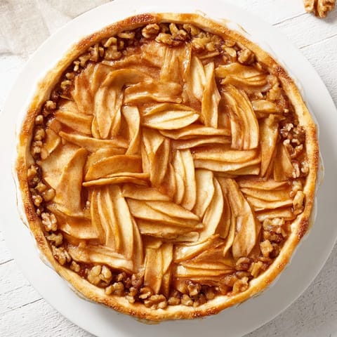 Visual treat: Close-up of the lattice orchard dessert, filled with honey-glazed walnuts, ready to eat.