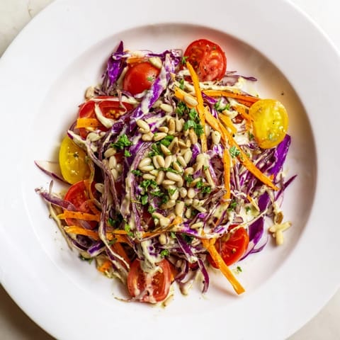Fresh Rainbow Salad, visually appealing: a healthy vegan meal with bright red and yellow peppers.