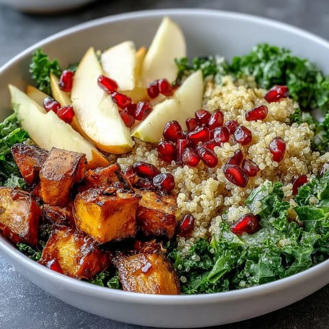 Roasted sweet potatoes and fluffy quinoa top this colorful Kale Harvest Grain Bowl.
