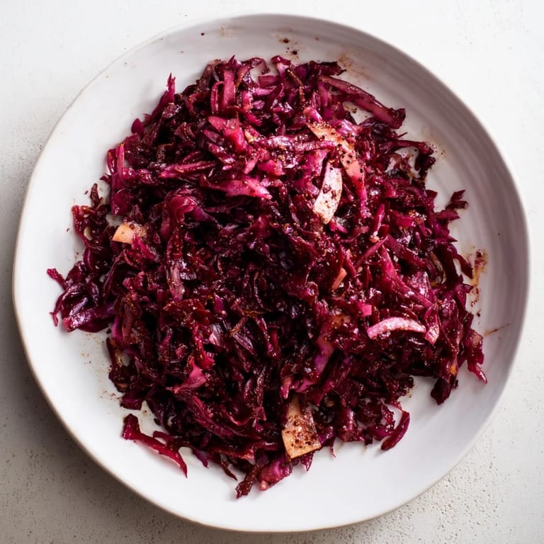 Vibrant plate of Sweet & Sour Bavarian Red Cabbage & Apples, a vegetarian-friendly side dish bursting with flavor.