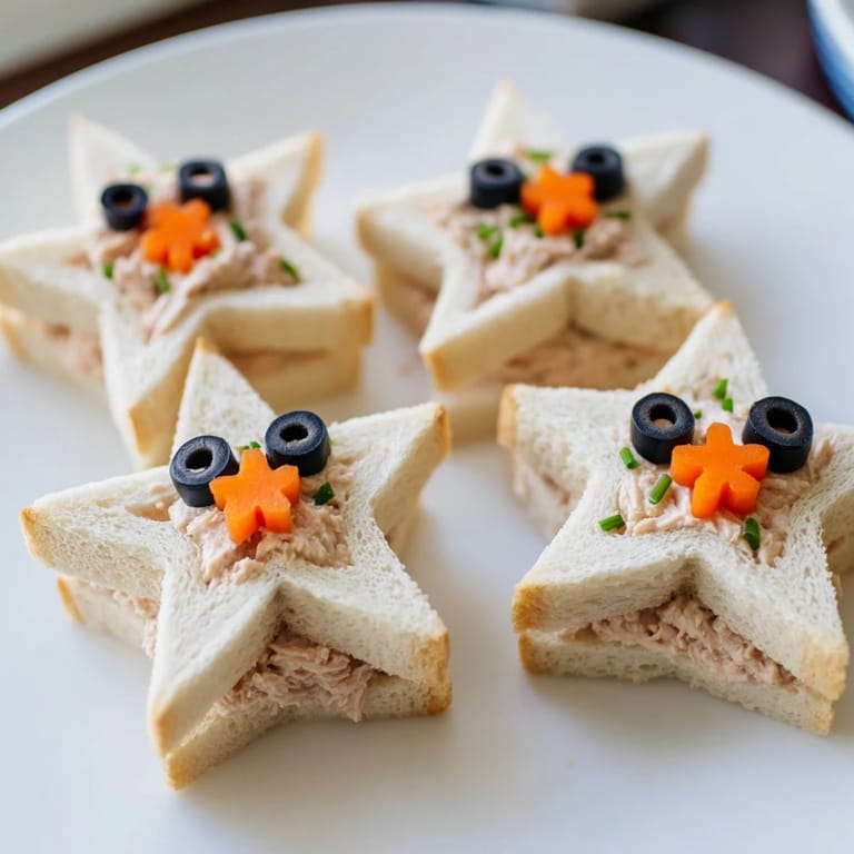 Delicate tuna-filled Mini Starfish Sandwiches on a platter, showcasing the fun, ocean-themed appetizer.