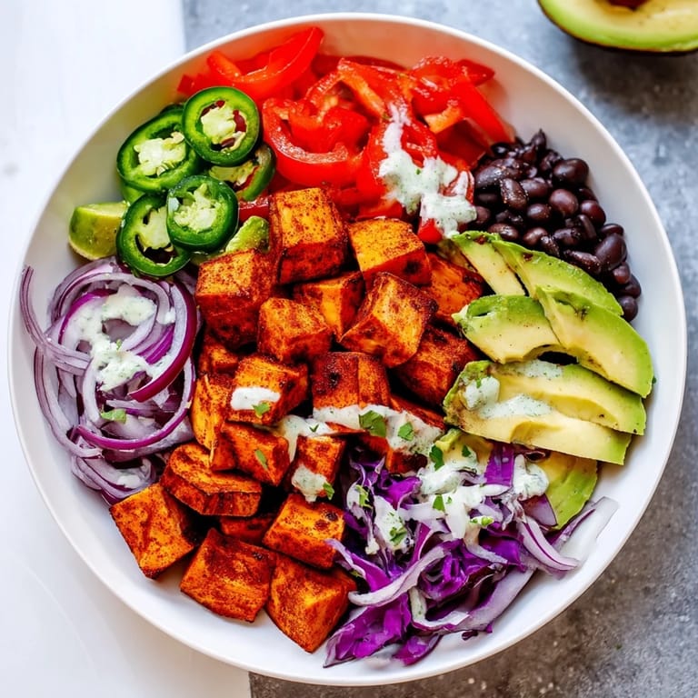 Hearty and flavorful Sweet Potato Taco Bowls, a vegan meal with black beans and avocado.