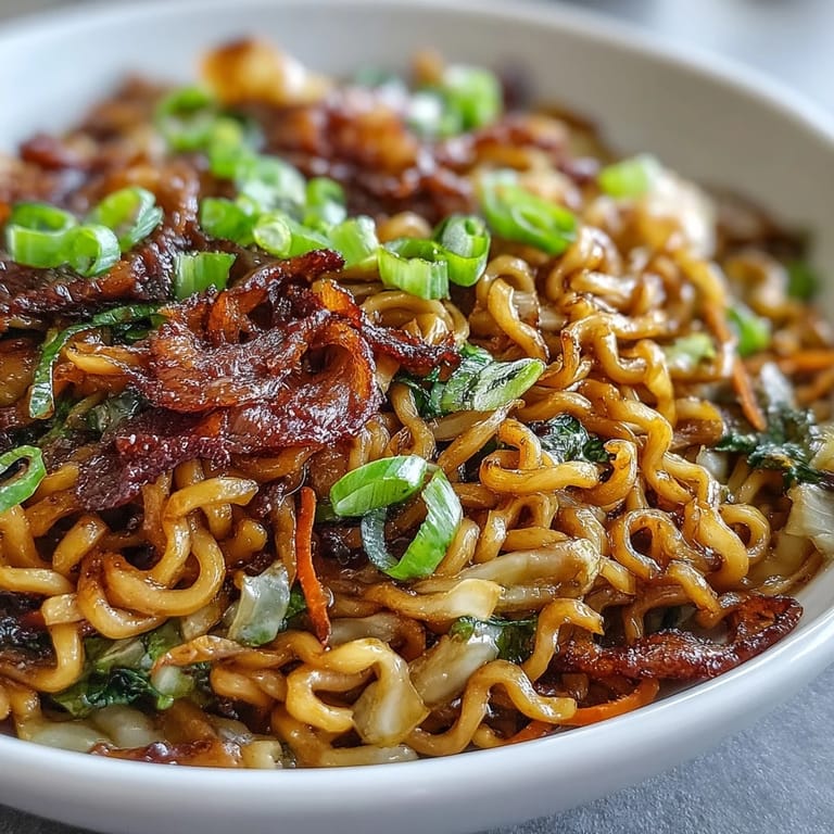 Close-up of Fried Cabbage Ramen with crunchy caramelized cabbage and chewy noodles in a wok.