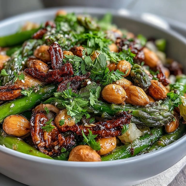 Fresh celery and peanut salad tossed with soy ginger dressing, served in a rustic wooden bowl for a light, crunchy meal.